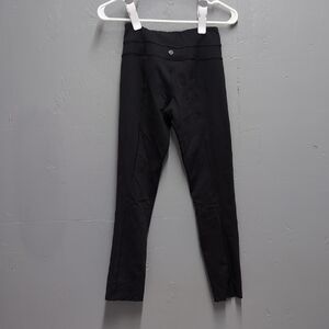 Lululemon Black Legging Size 2 Cut/Raw Hem On Legs. Crop.